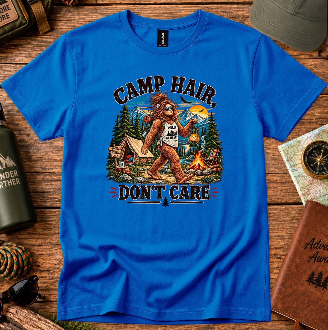 T-shirt featuring a playful camping graphic with Camp Hair Don't Care lettering