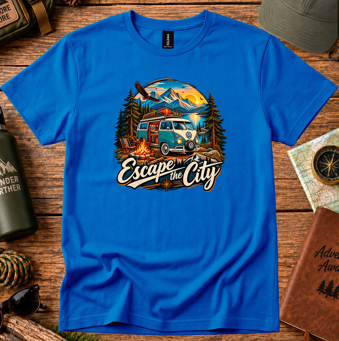 T-shirt featuring a retro camper by a mountain lake and glowing campfire