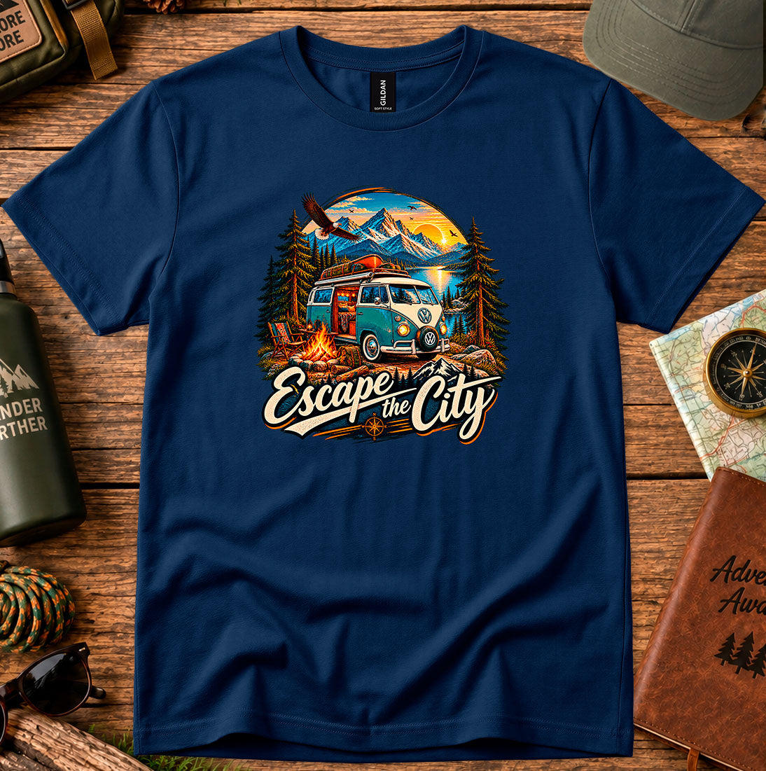 T-shirt featuring a retro camper by a mountain lake and glowing campfire