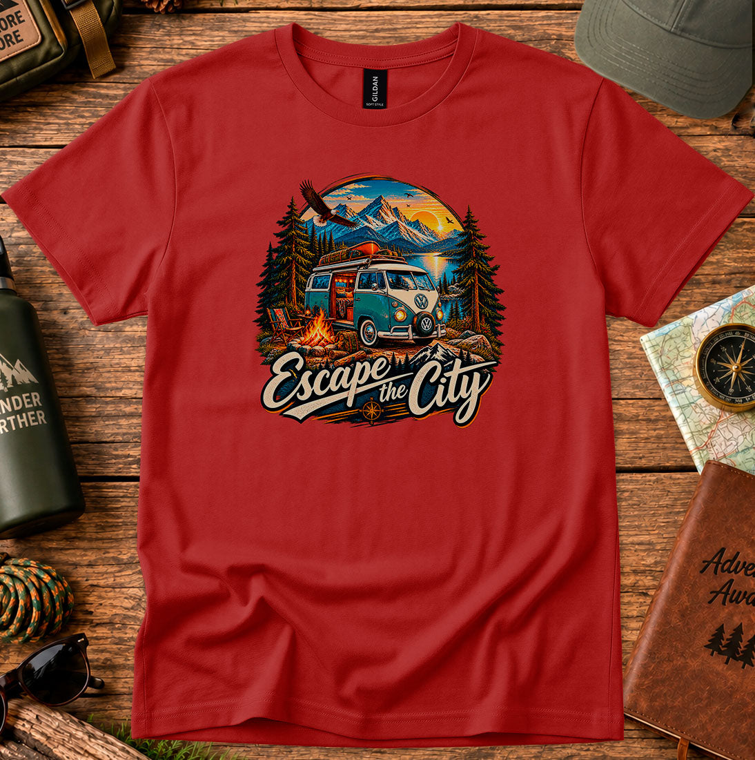 T-shirt featuring a retro camper by a mountain lake and glowing campfire