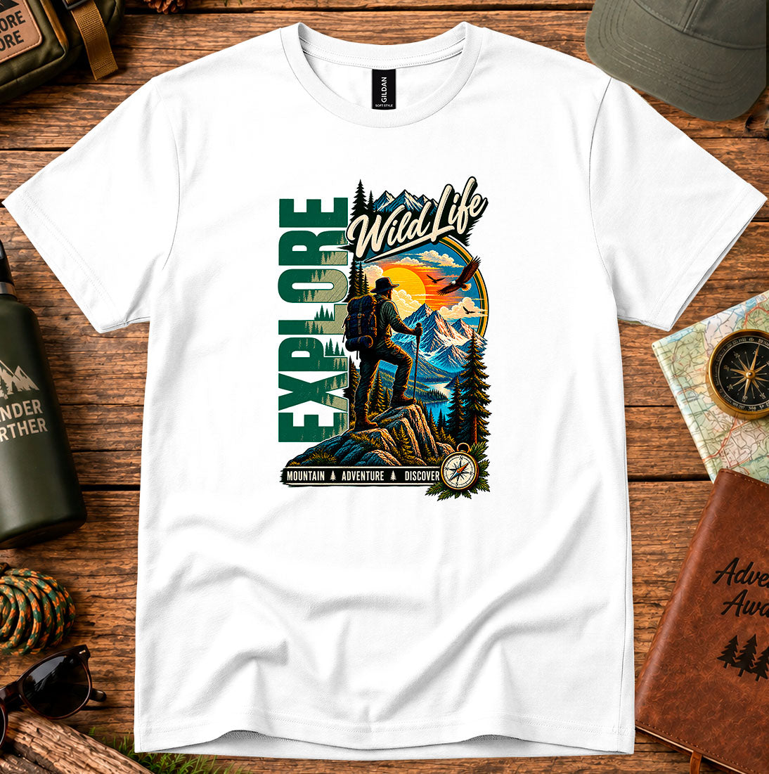 T-shirt featuring a hiker, pine forests and a mountain sunset with Explore lettering