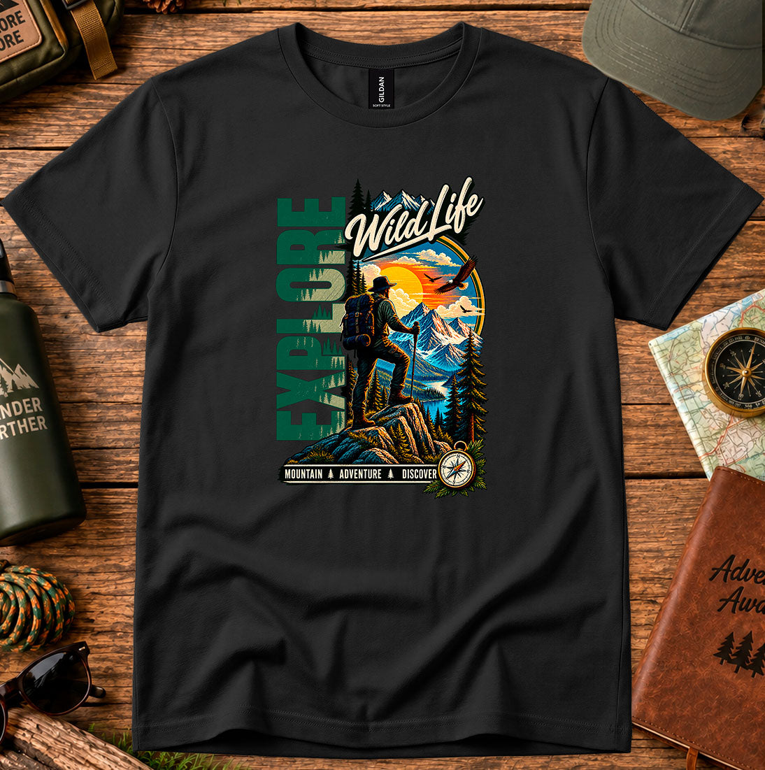 T-shirt featuring a hiker, pine forests and a mountain sunset with Explore lettering