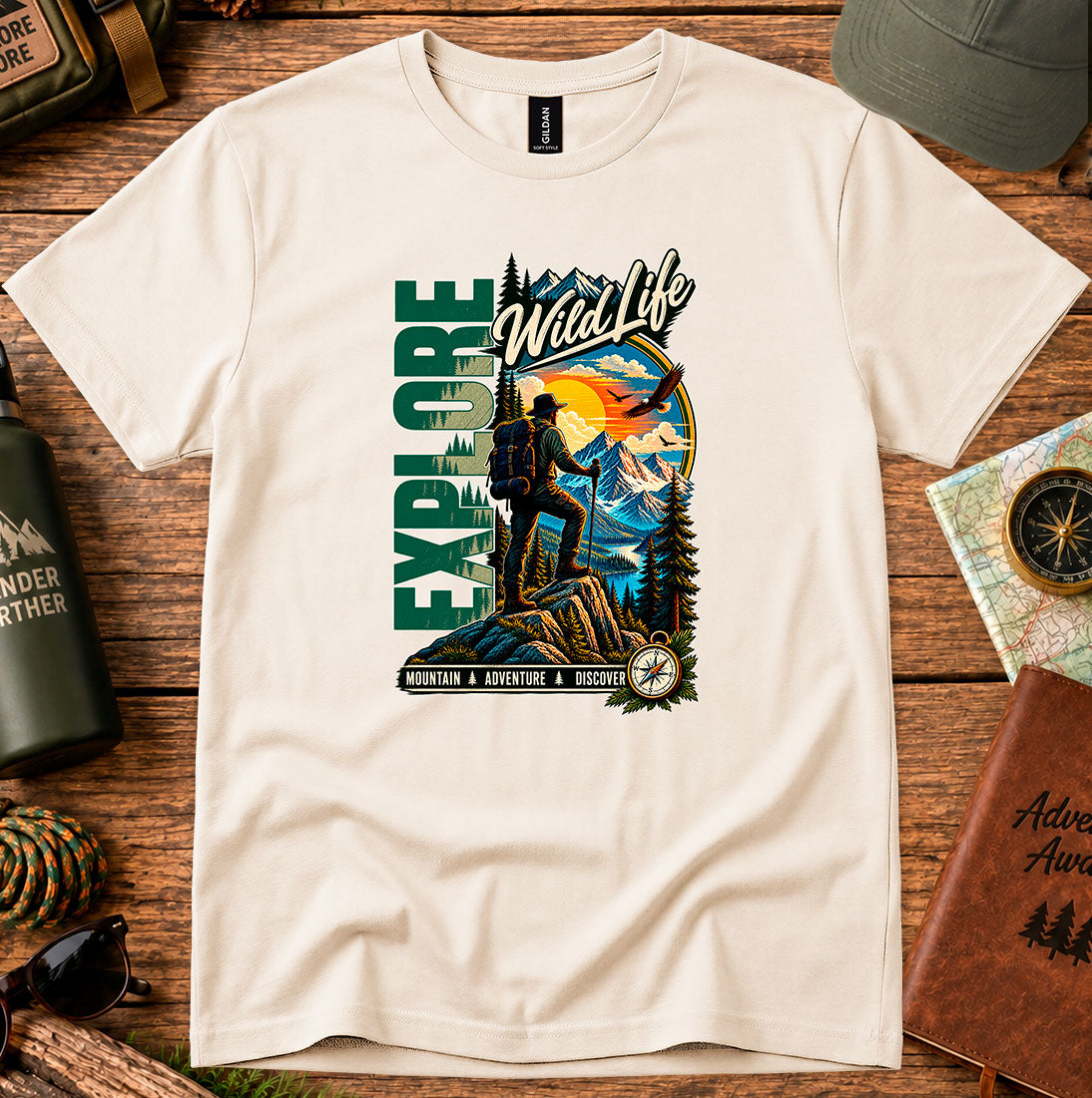 T-shirt featuring a hiker, pine forests and a mountain sunset with Explore lettering