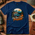 T-shirt featuring a vintage camper and campfire beneath a mountain sunset