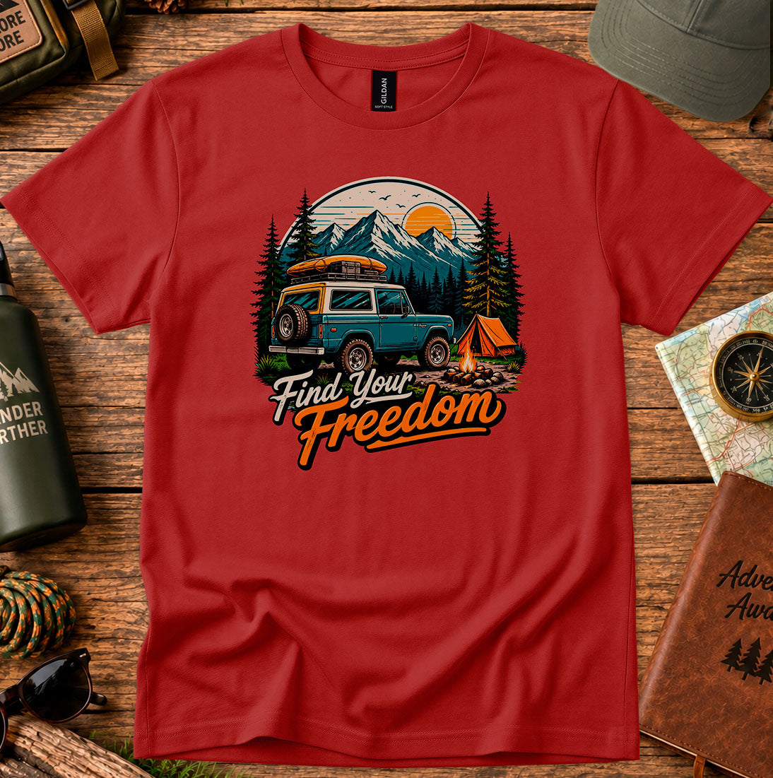T-shirt featuring a vintage camper and campfire beneath a mountain sunset