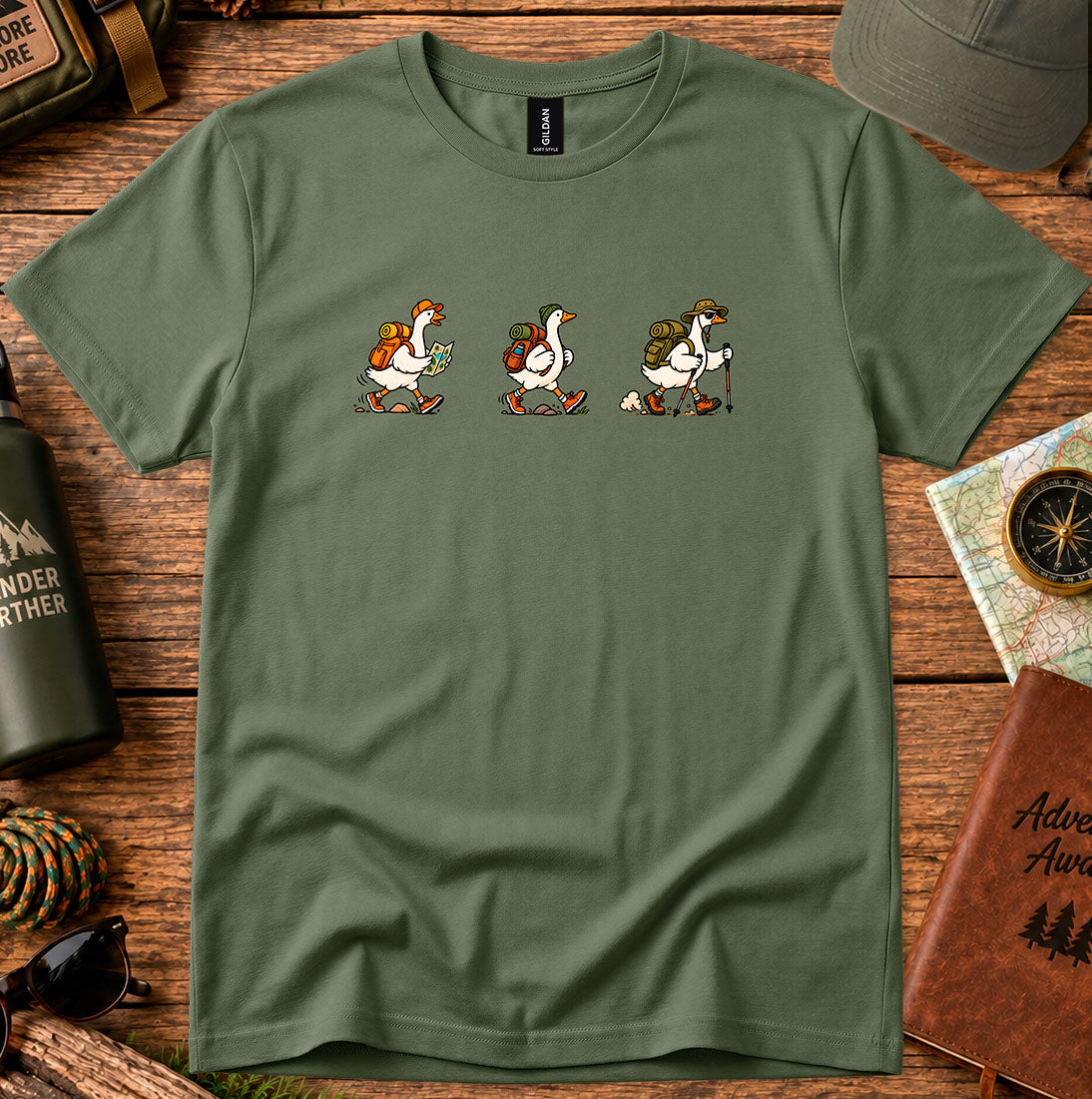 T-shirt featuring a playful trio of hiking ducks
