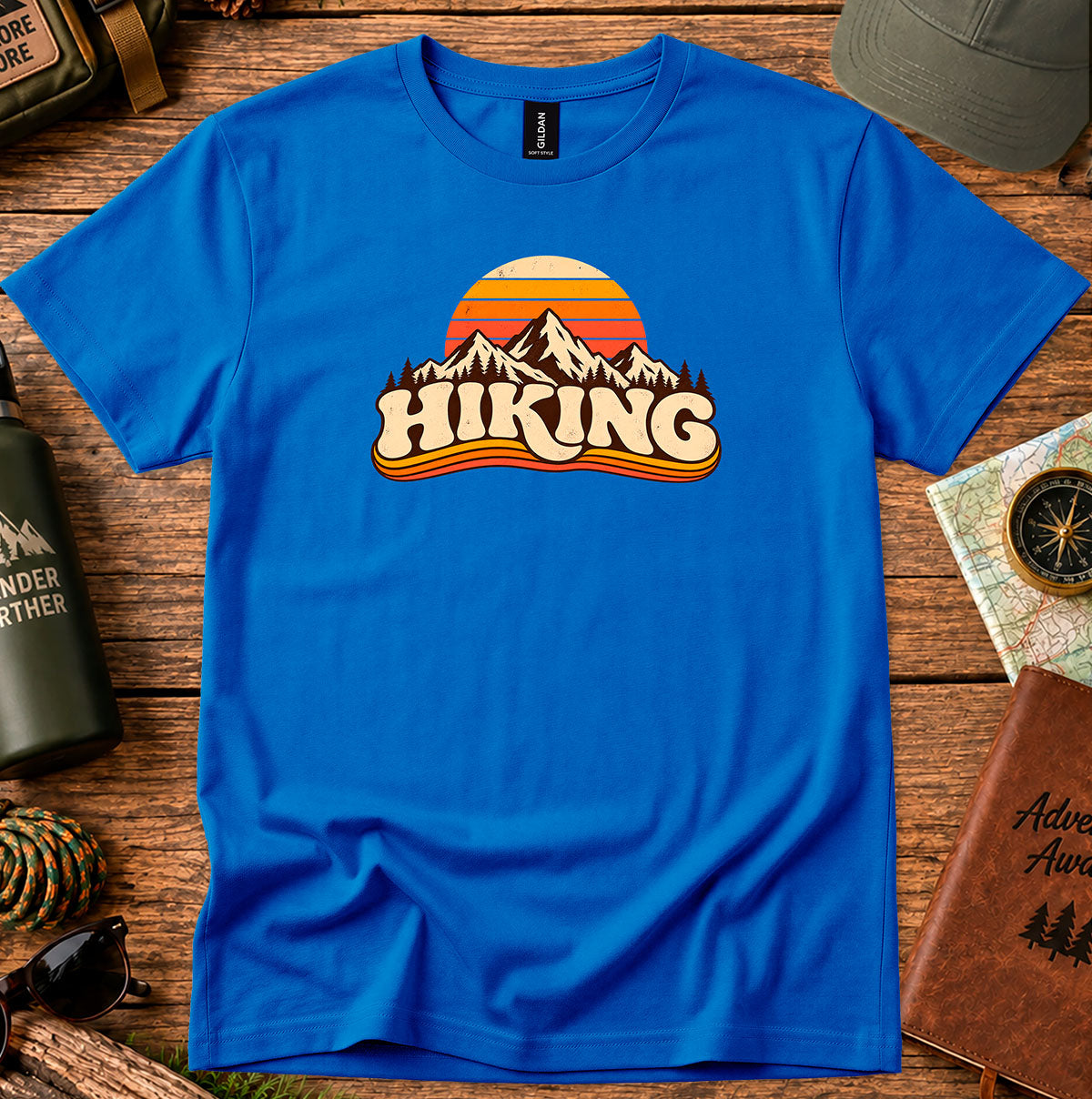 Royal blue T-shirt featuring a retro sunset and mountain graphic above HIKING lettering