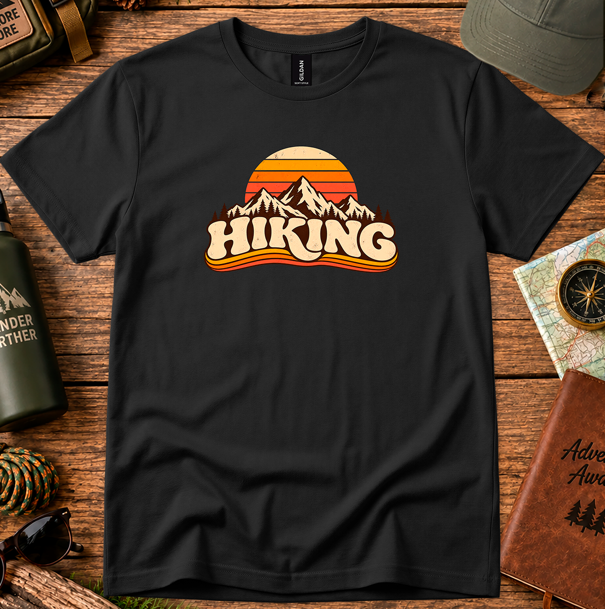 Black T-shirt featuring a retro sunset and mountain graphic above HIKING lettering