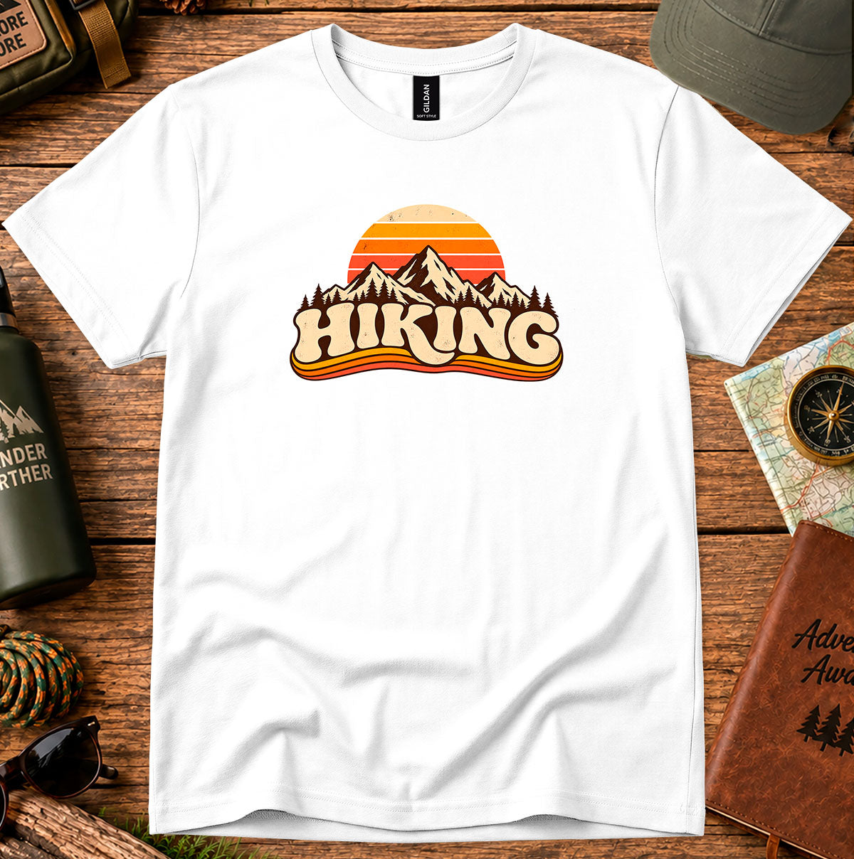 White T-shirt featuring a retro sunset and mountain graphic above HIKING lettering