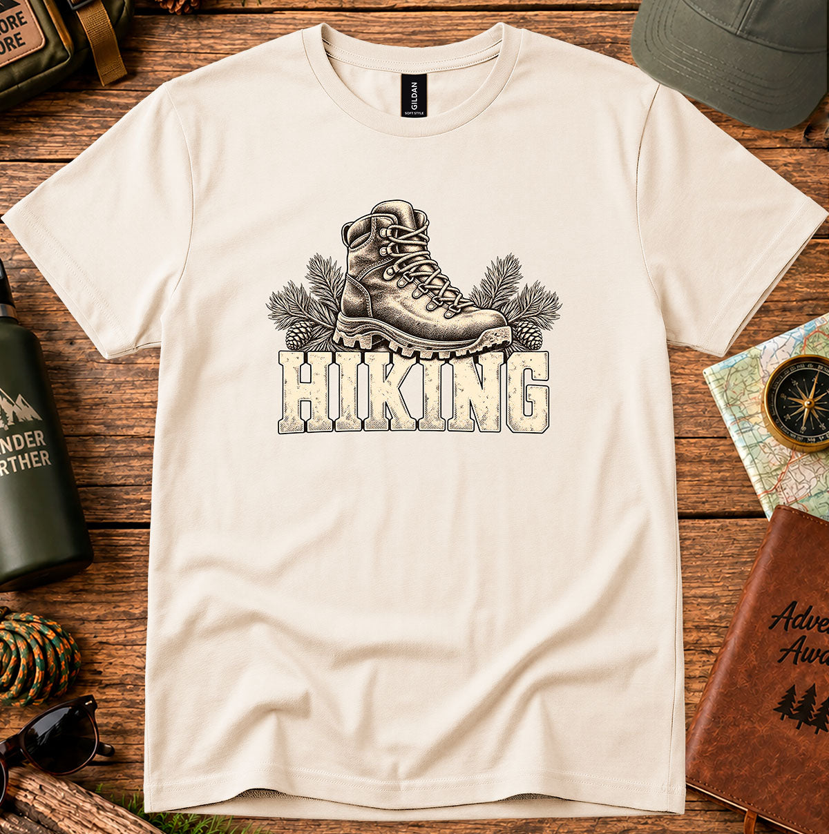 Cream T-shirt featuring a vintage hiking boot above HIKING lettering