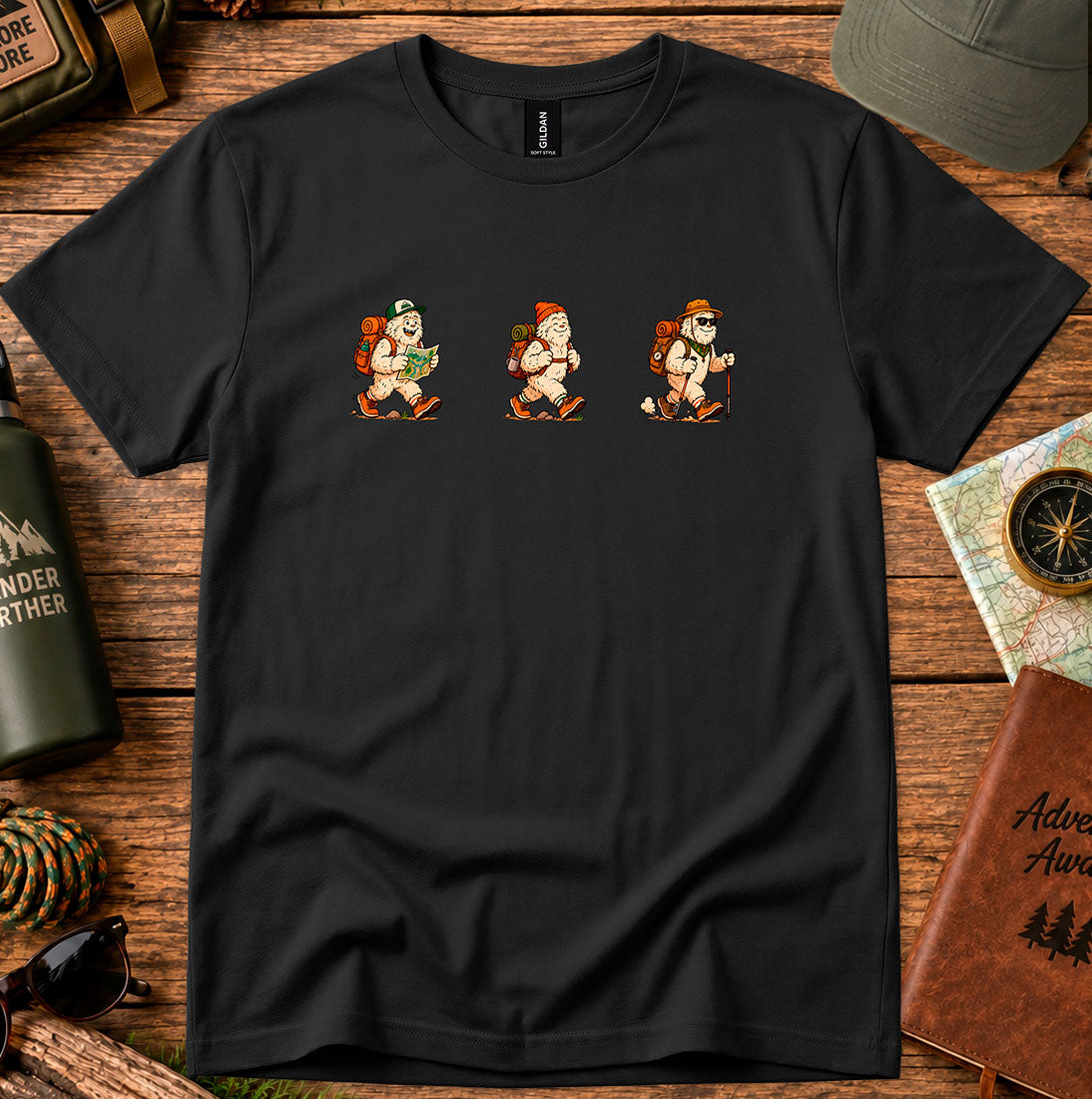 T-shirt featuring a playful trio of retro-style Bigfoot hikers