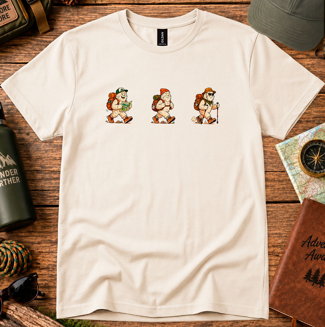 T-shirt featuring a playful trio of retro-style Bigfoot hikers