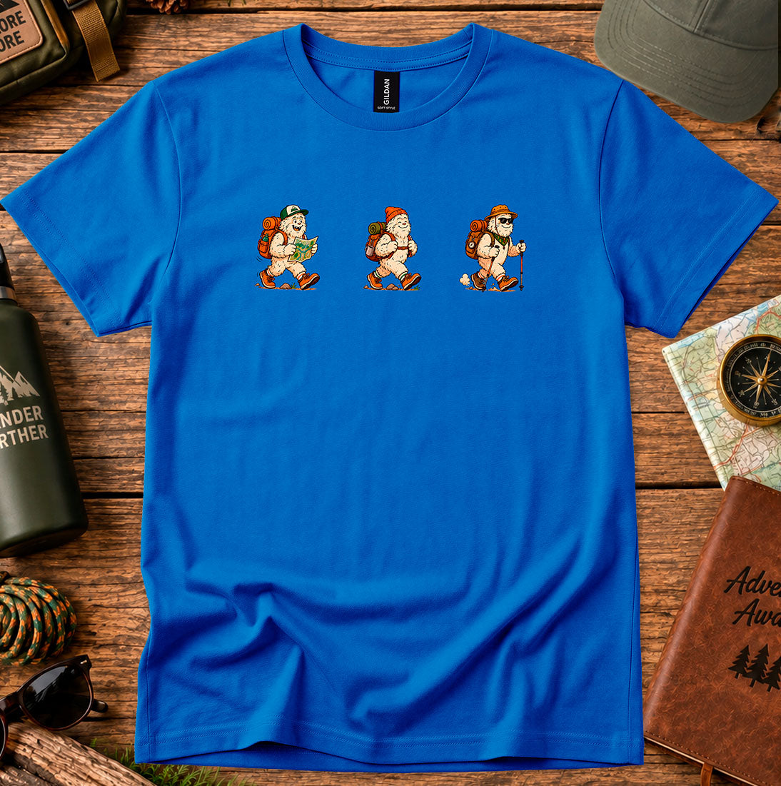 T-shirt featuring a playful trio of retro-style Bigfoot hikers
