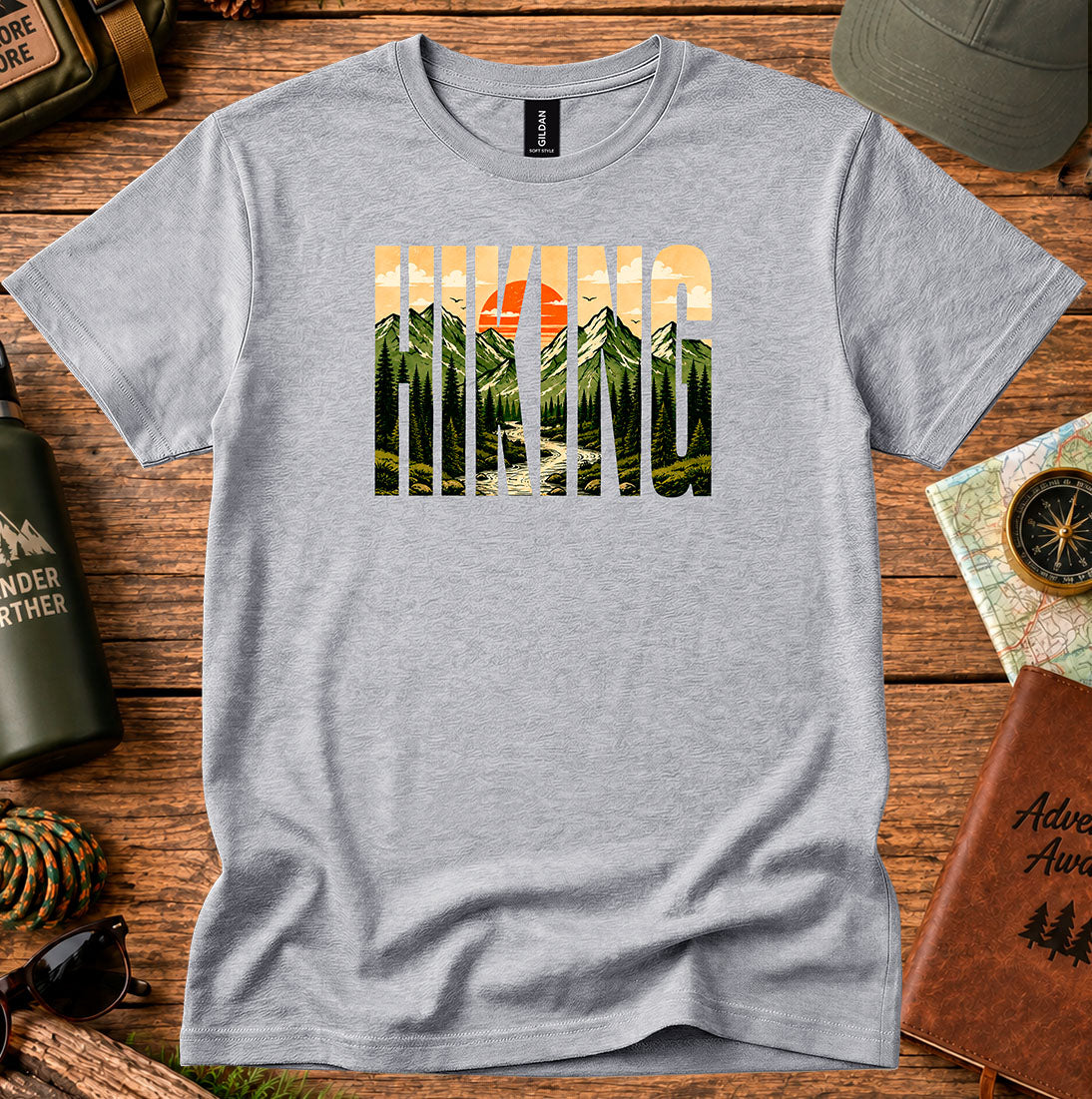 T-shirt featuring bold Hiking lettering filled with mountain and sunset scenery