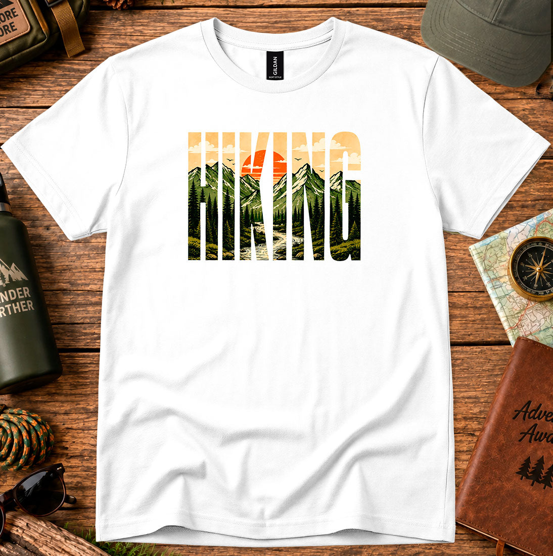 T-shirt featuring bold Hiking lettering filled with mountain and sunset scenery