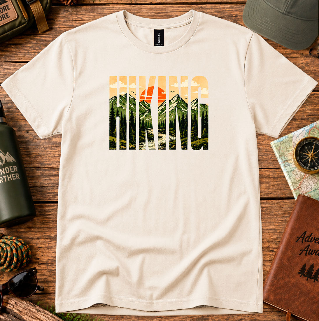 T-shirt featuring bold Hiking lettering filled with mountain and sunset scenery