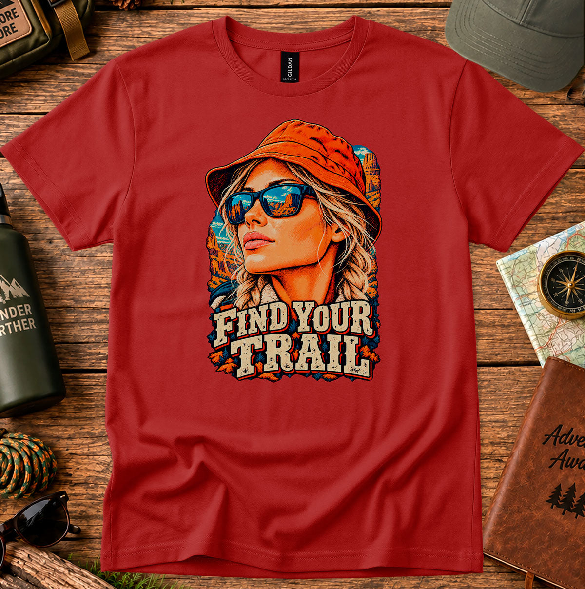 Find Your Trail T-shirt with a vintage woman adventurer wearing a hat and mirrored sunglasses