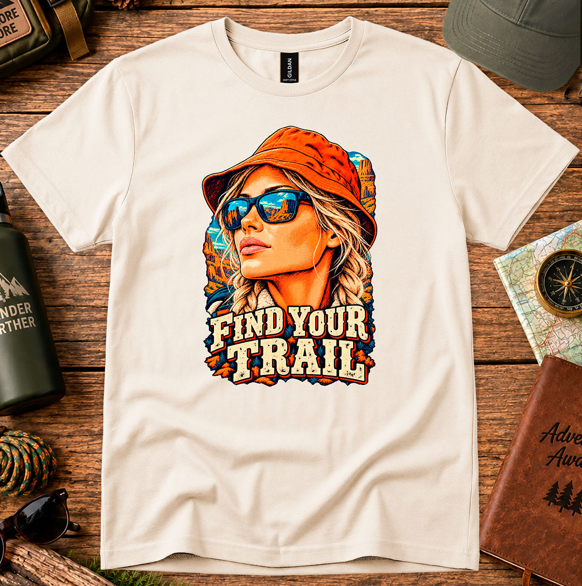 Find Your Trail T-shirt with a vintage woman adventurer wearing a hat and mirrored sunglasses