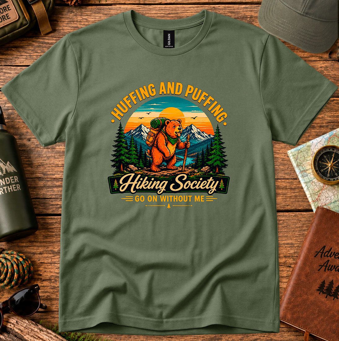 T-shirt featuring a humorous mountain hiker graphic with pine trees