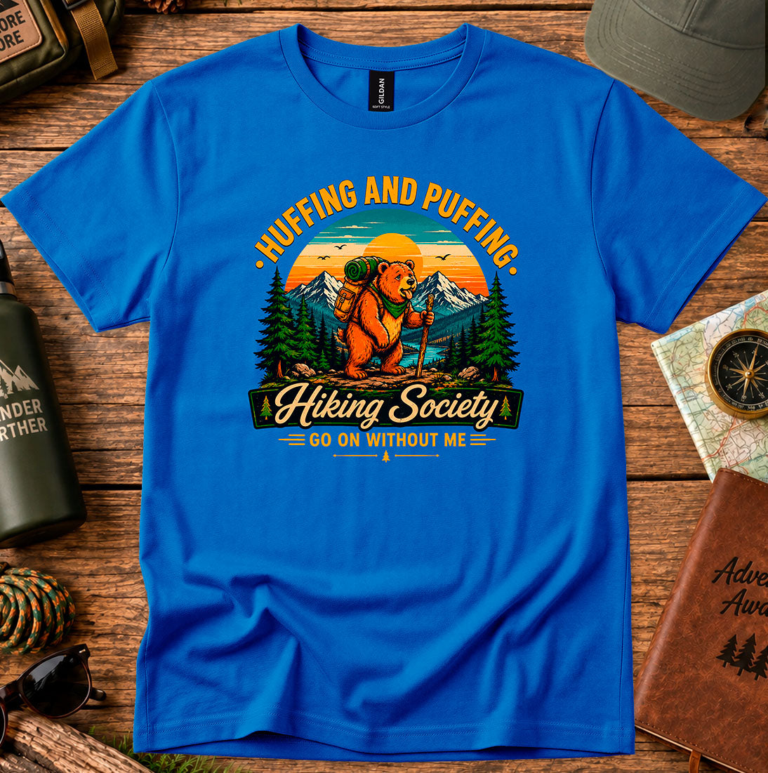 T-shirt featuring a humorous mountain hiker graphic with pine trees