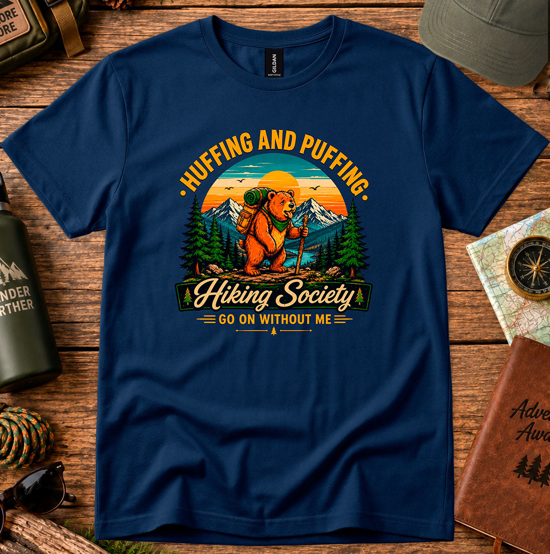 T-shirt featuring a humorous mountain hiker graphic with pine trees