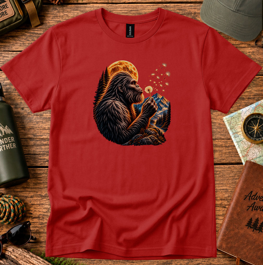 T-shirt featuring a gorilla blowing dandelion seeds beneath a glowing moon