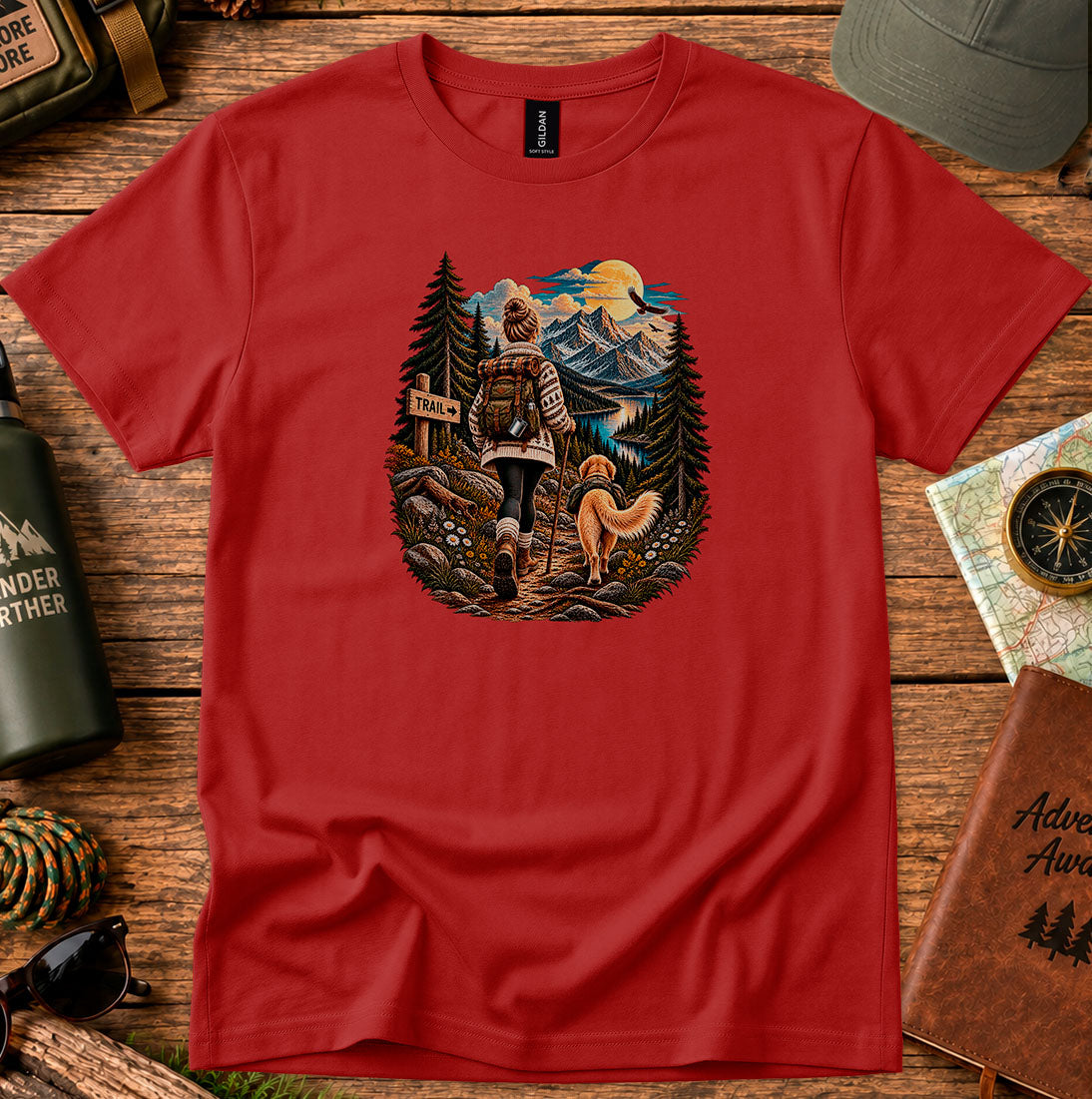 T-shirt featuring a hiker at a trail sign overlooking a mountain valley