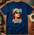 Adventure Awaits T-shirt showing an explorer in sunglasses framed by mountain peaks