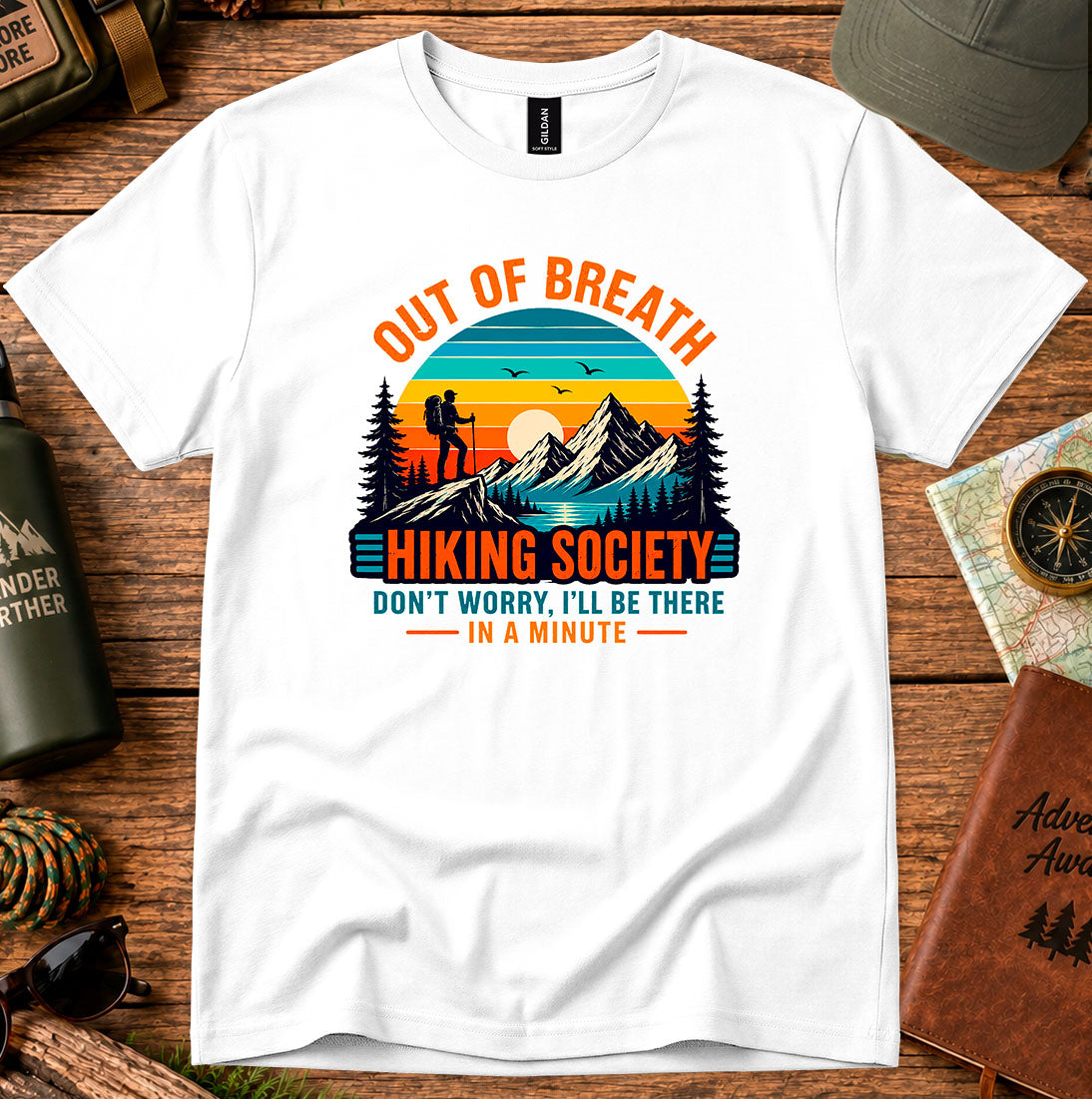T-shirt featuring hikers on a sunlit ridge with Out of Breath lettering