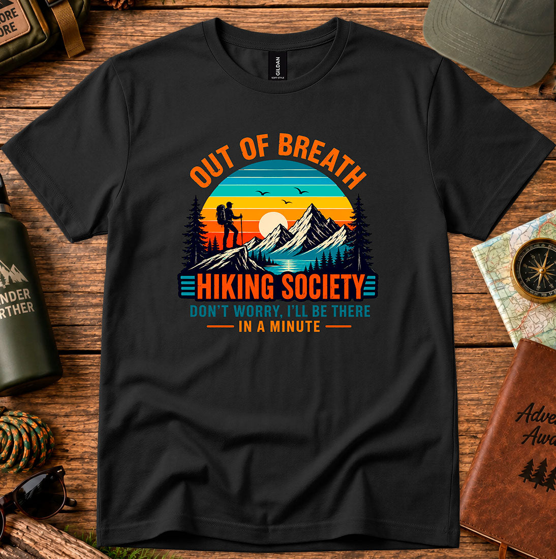 T-shirt featuring hikers on a sunlit ridge with Out of Breath lettering
