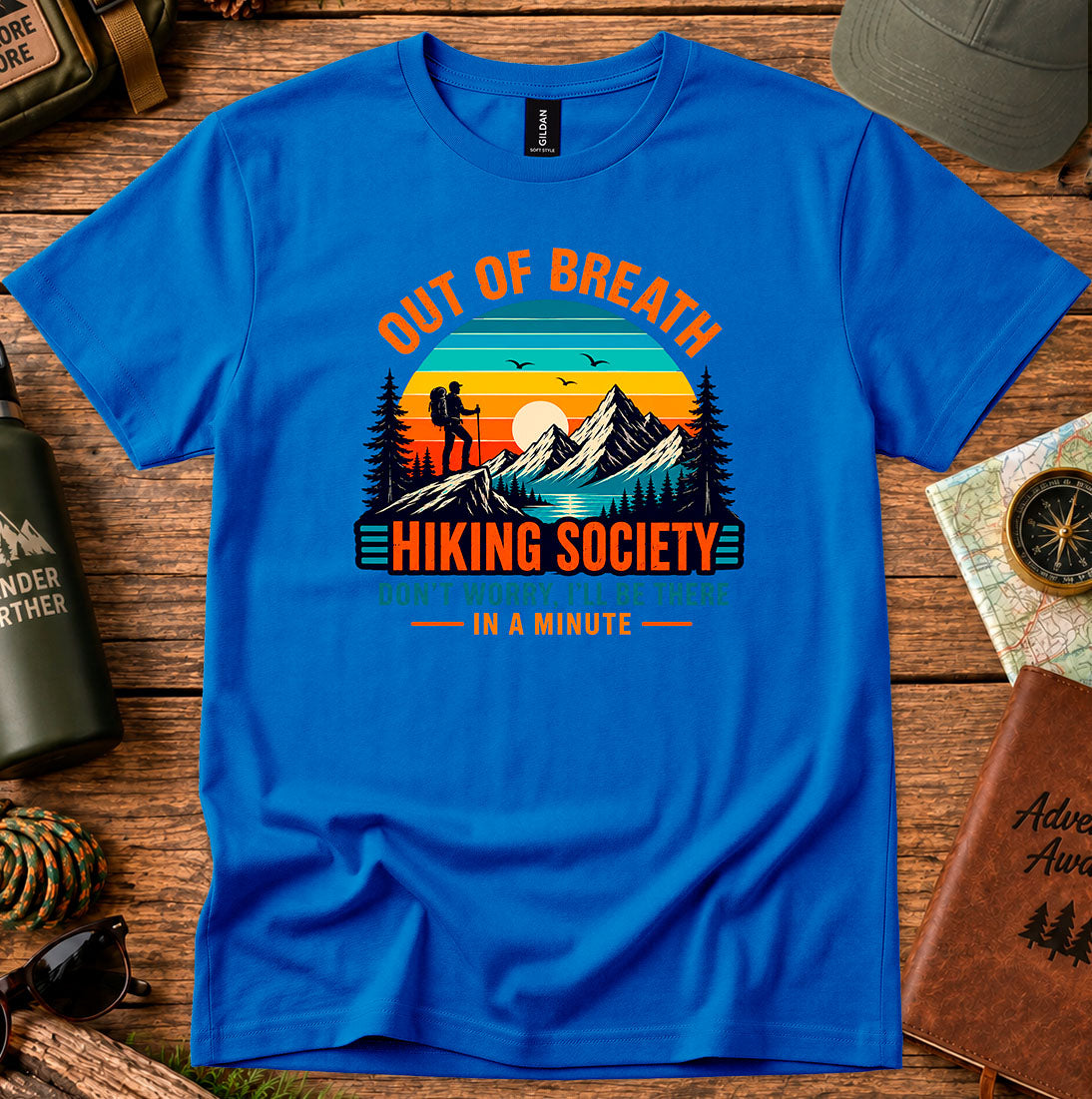 T-shirt featuring hikers on a sunlit ridge with Out of Breath lettering