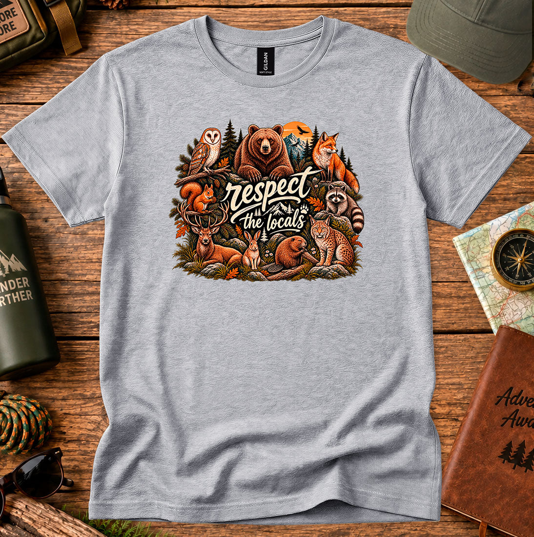 T-shirt featuring woodland animals including a bear, owl, fox and raccoon