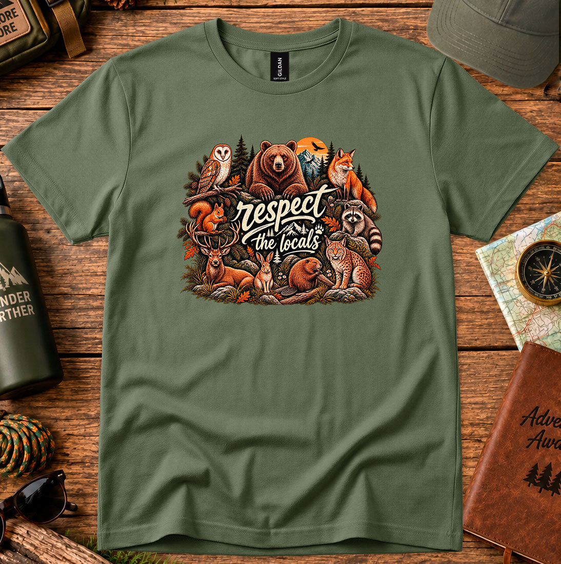 T-shirt featuring woodland animals including a bear, owl, fox and raccoon