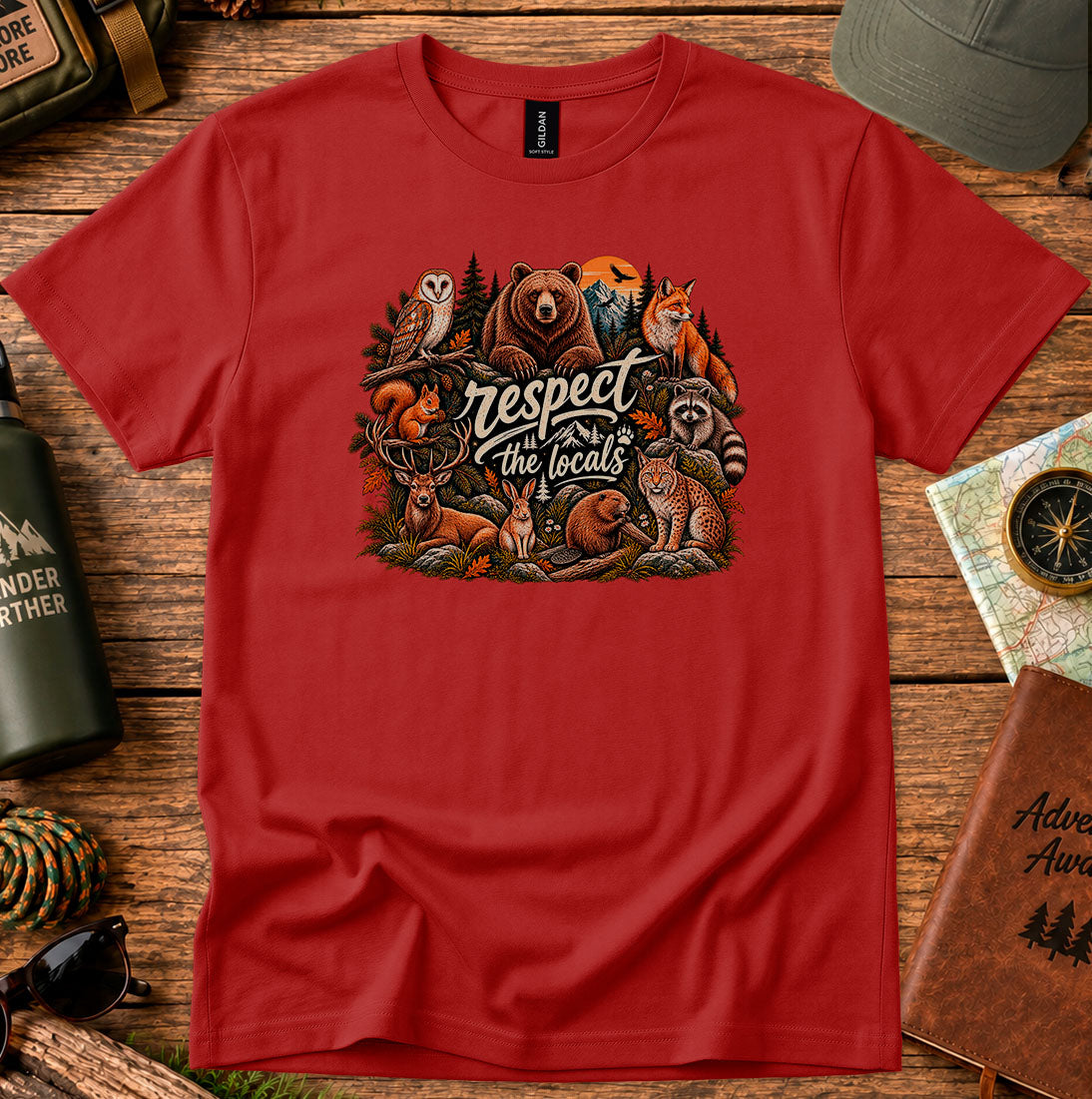 T-shirt featuring woodland animals including a bear, owl, fox and raccoon