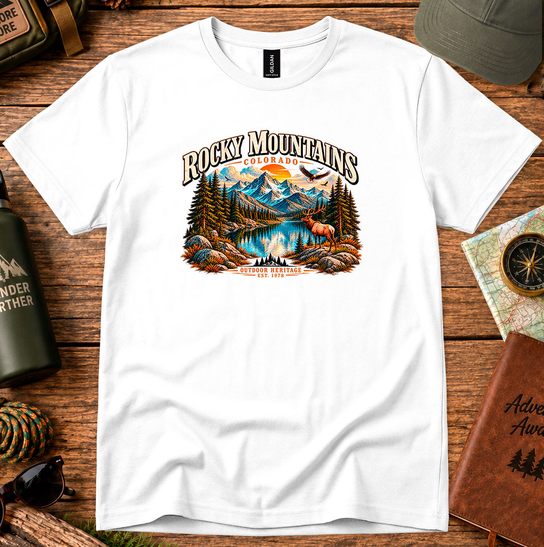 T-shirt featuring Rocky Mountain peaks, pine forests and an elk by an alpine lake