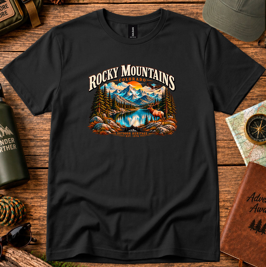 T-shirt featuring Rocky Mountain peaks, pine forests and an elk by an alpine lake