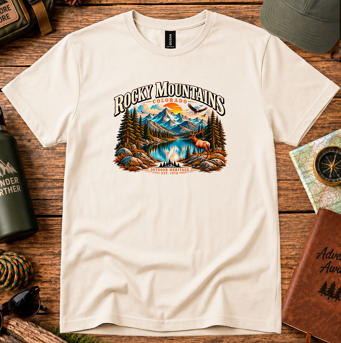 T-shirt featuring Rocky Mountain peaks, pine forests and an elk by an alpine lake