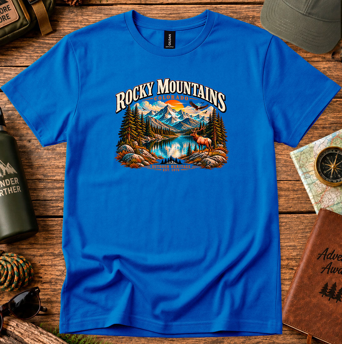 T-shirt featuring Rocky Mountain peaks, pine forests and an elk by an alpine lake
