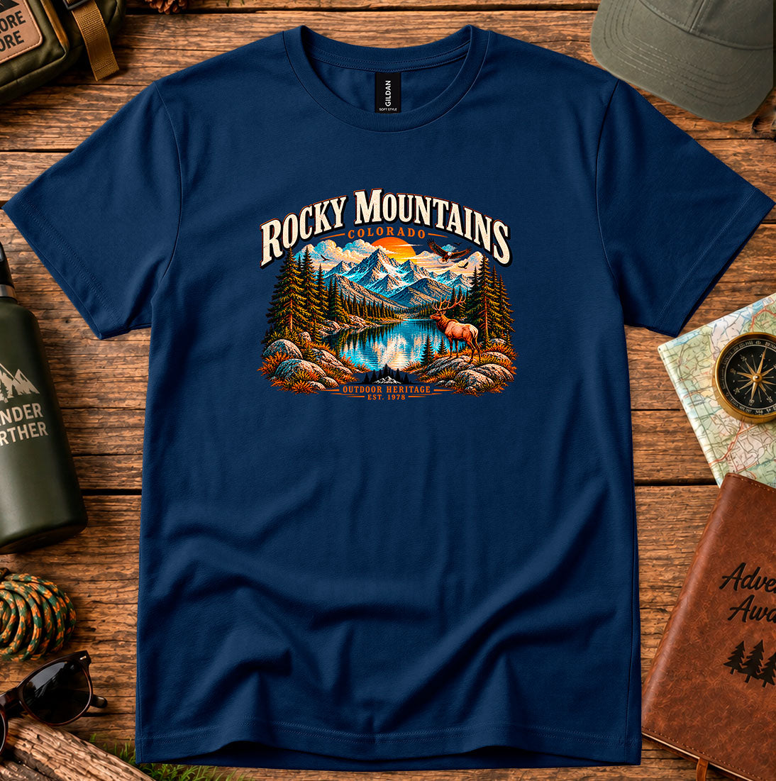 T-shirt featuring Rocky Mountain peaks, pine forests and an elk by an alpine lake