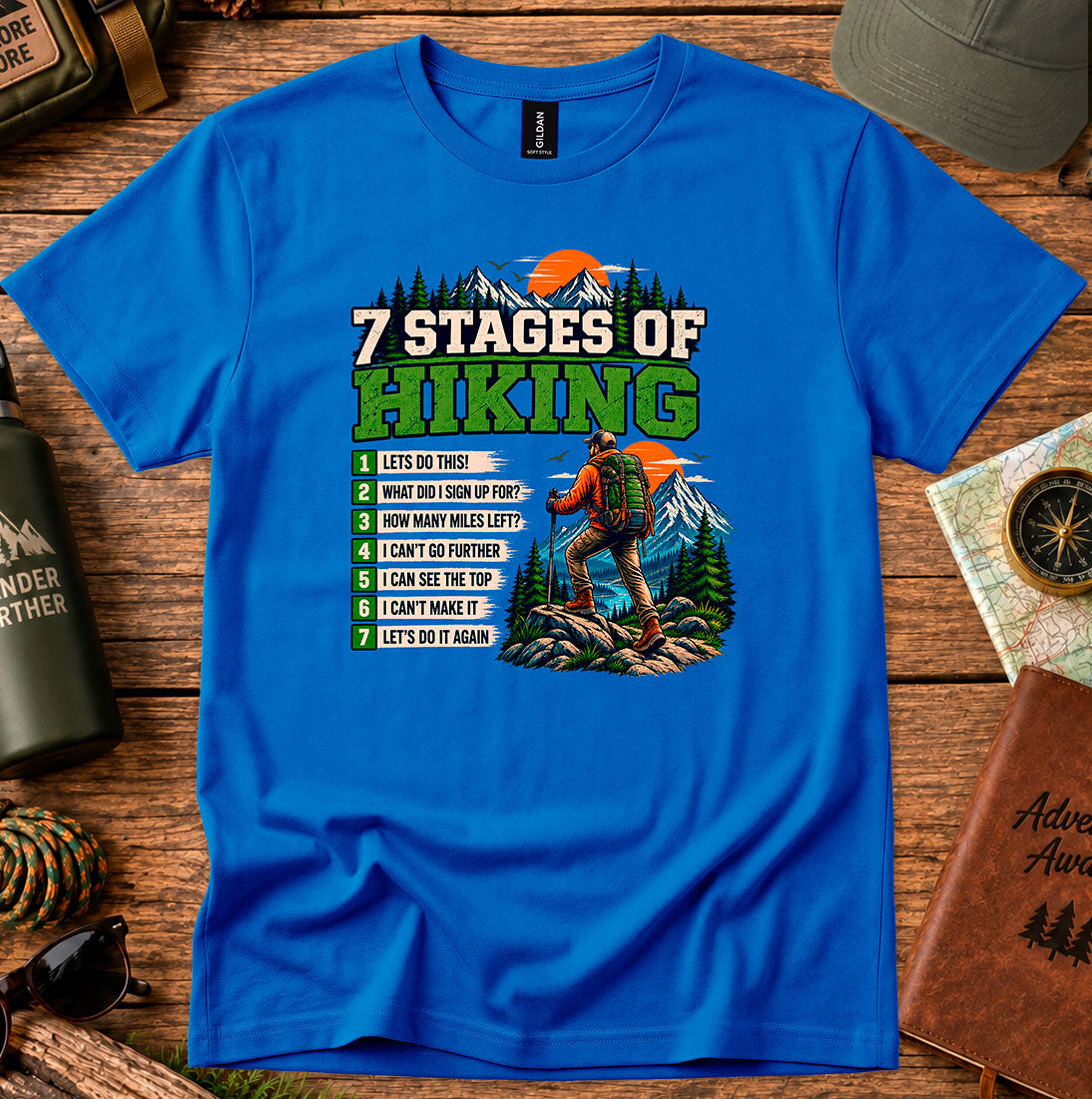 T-shirt featuring a Stages of Hiking checklist with a hiker and sunset