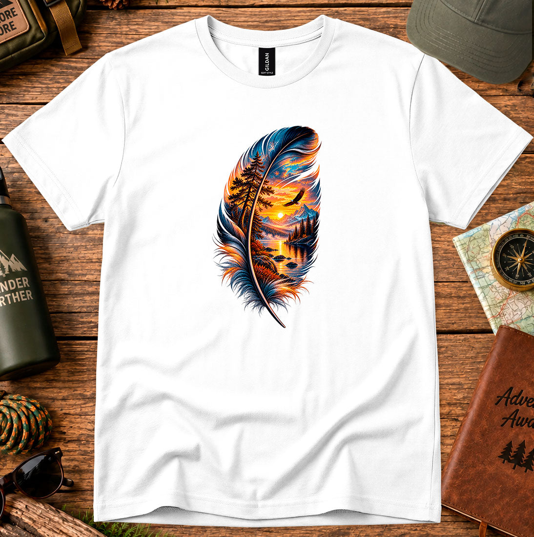 T-shirt featuring a feather framing a sunset shoreline and a soaring bird