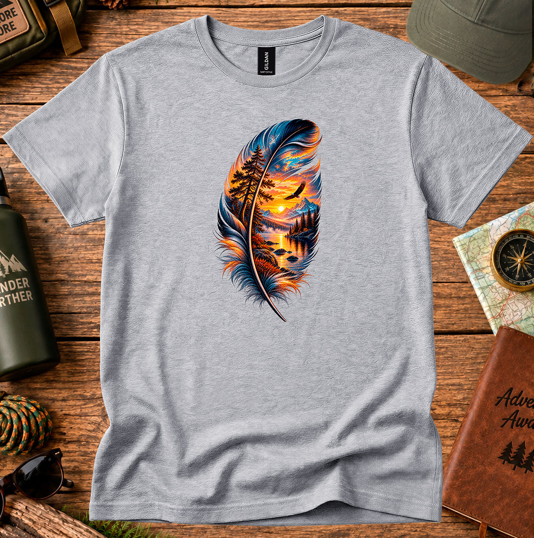 T-shirt featuring a feather framing a sunset shoreline and a soaring bird