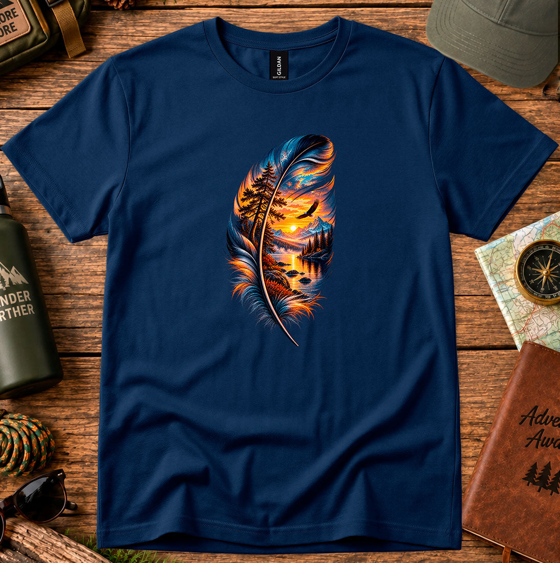 T-shirt featuring a feather framing a sunset shoreline and a soaring bird
