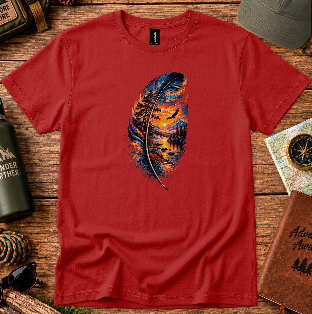 T-shirt featuring a feather framing a sunset shoreline and a soaring bird