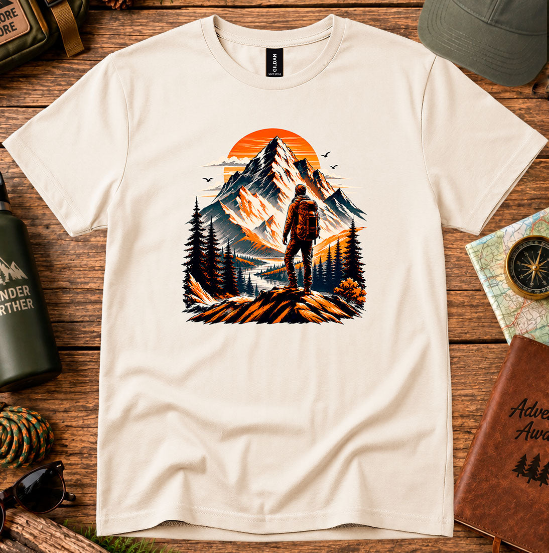 T-shirt featuring a lone hiker silhouetted against a glowing mountain sky
