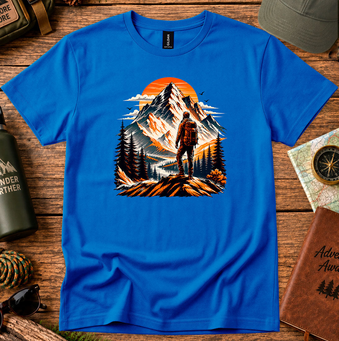 T-shirt featuring a lone hiker silhouetted against a glowing mountain sky