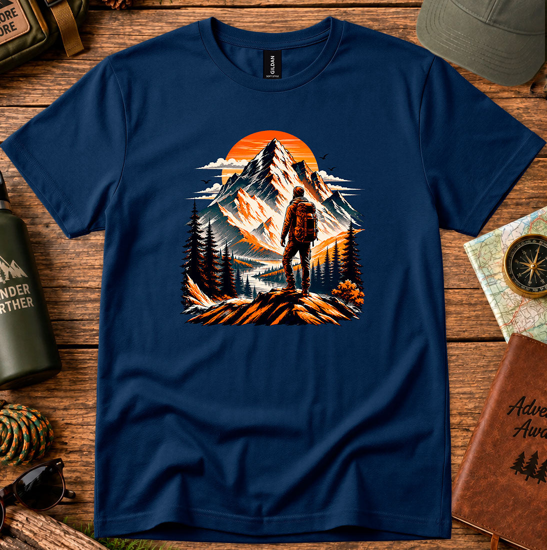 T-shirt featuring a lone hiker silhouetted against a glowing mountain sky