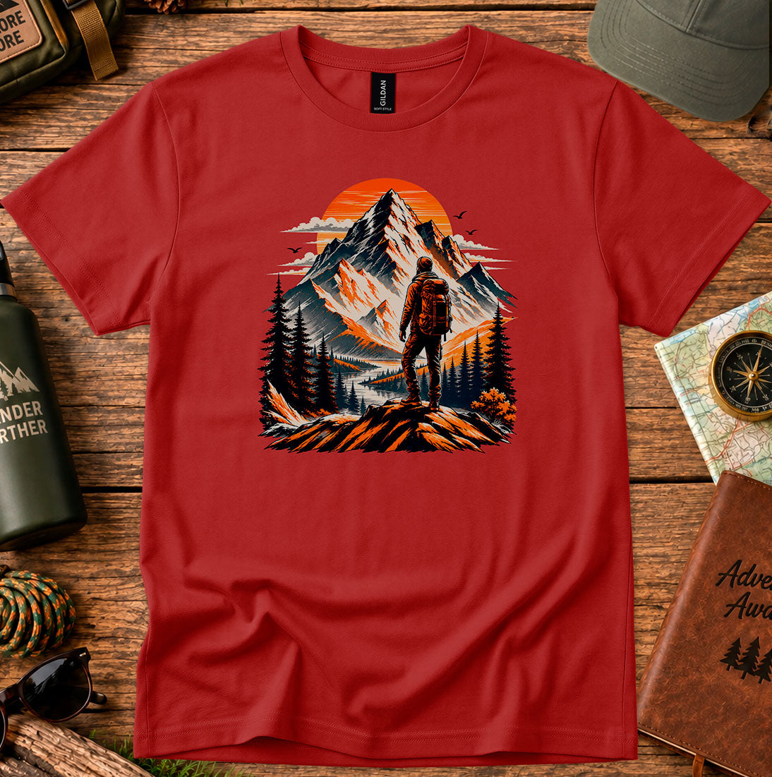 T-shirt featuring a lone hiker silhouetted against a glowing mountain sky