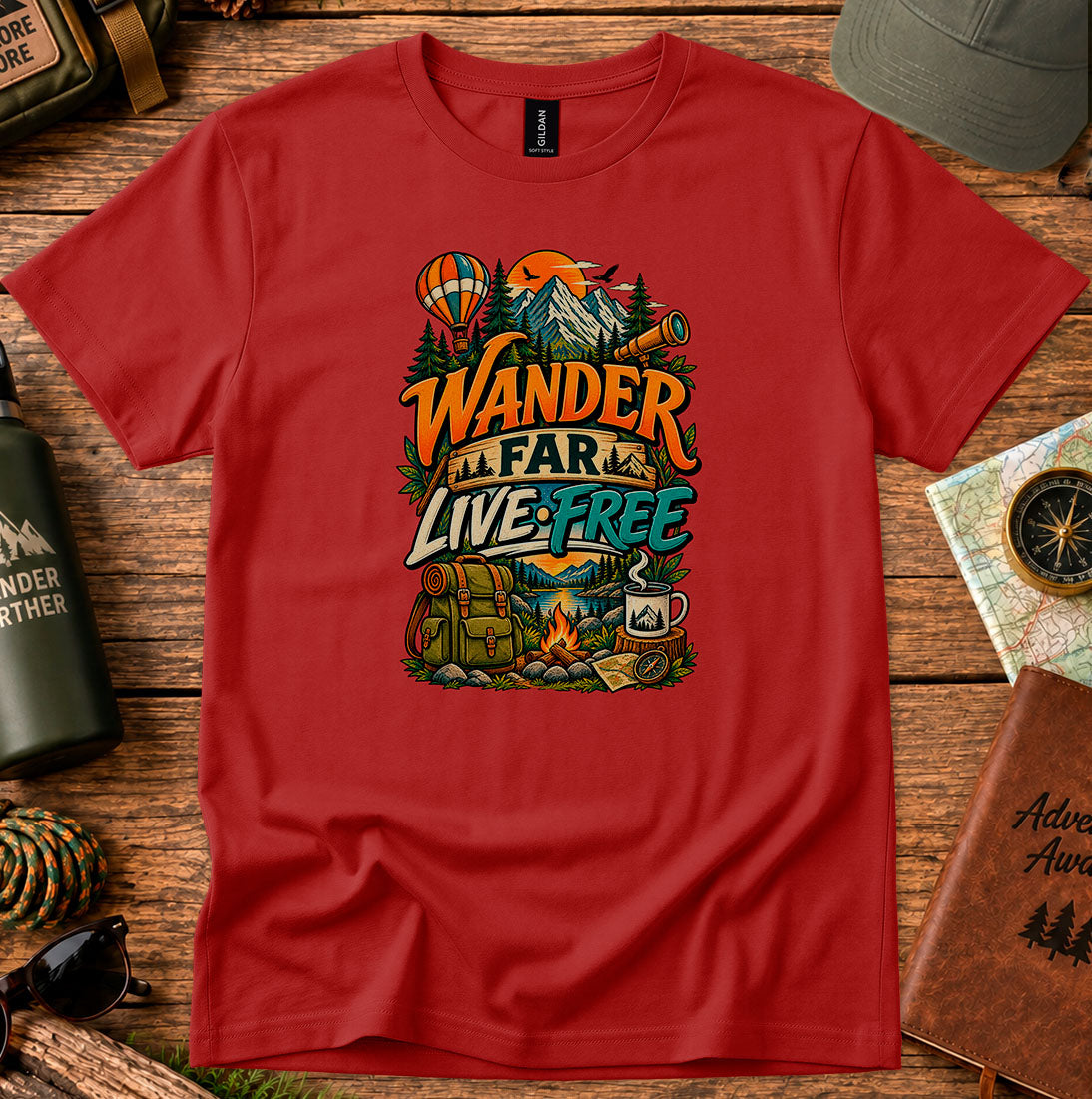 T-shirt featuring a mountain camp scene with a hot air balloon and campfire