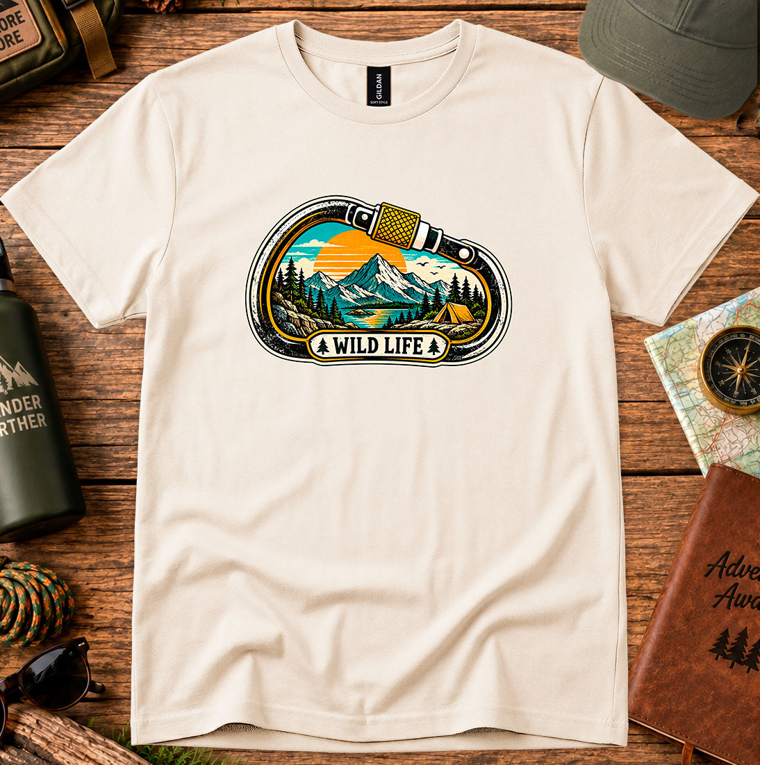 T-shirt featuring a carabiner framing mountain peaks, pine trees and a winding river